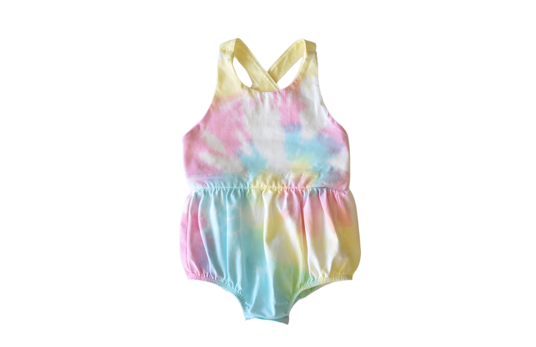 Baby bubble romper in pastel tie dye: cross back design