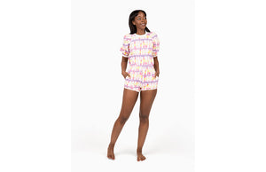 Model wearing matching tie dye loungewear set in pastel colors