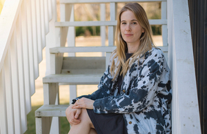 Adult black tie dye boyfriend jacket modeled by girl on steps