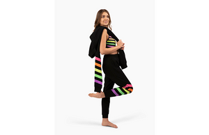 Girl in black matching activewear loungewear set with neon stripes