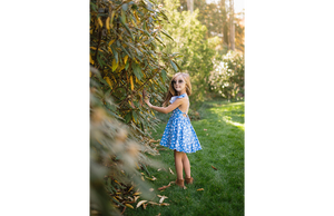 Model in ruffle sleeve dress in blue ducks